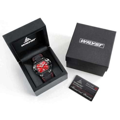 Boîte de montre avec une montre à cadran rouge à l'intérieur